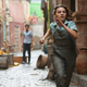Lyra (Dafne Keen) runs toward danger, per usual.
